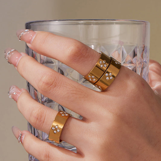 Stainless Steel Ring With Claw Settings And Plum Blossom-shaped Zircon Accents Brand: aeac